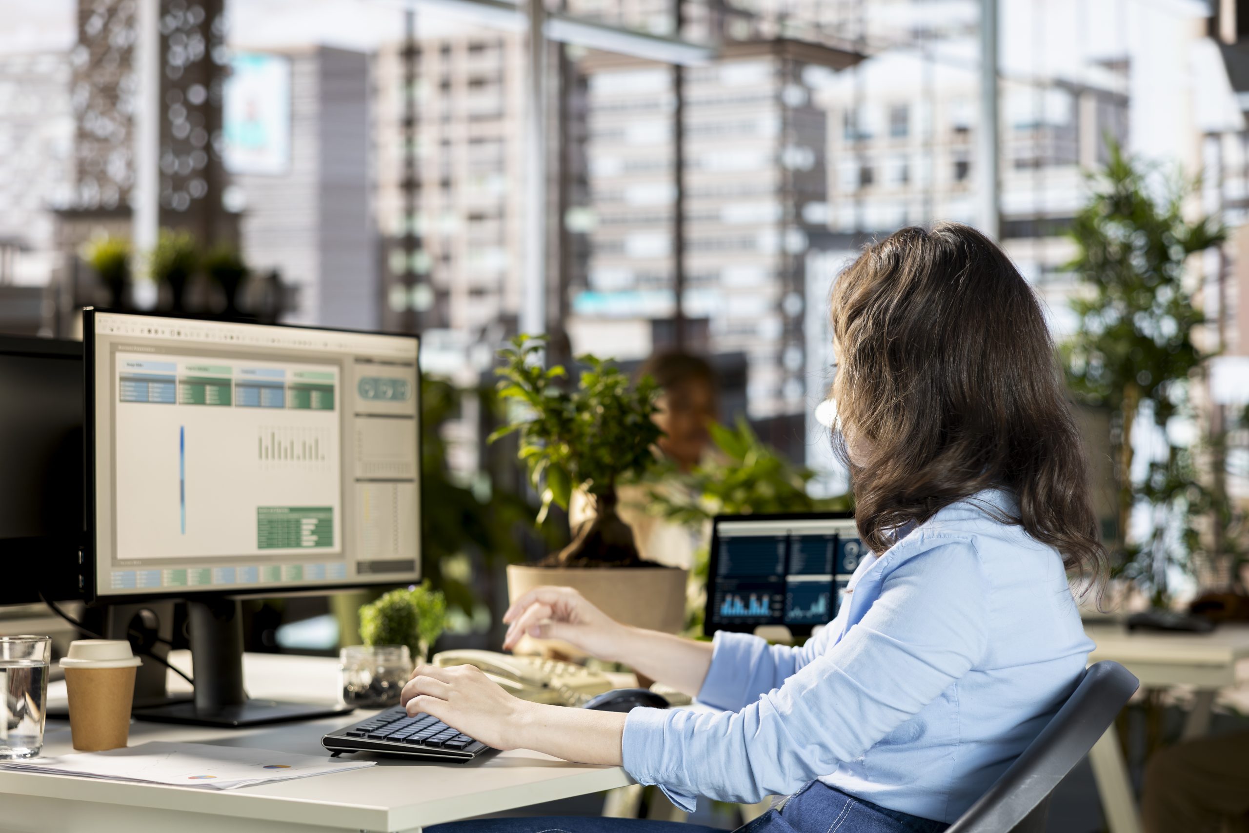 Female employee reviewing company data to work on a new strategy
